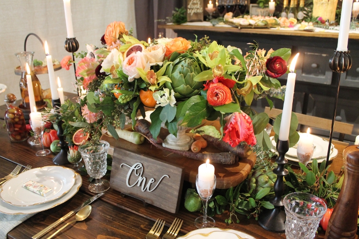 Floral centerpiece mixed with vegetables and fruit
